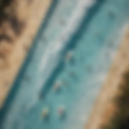 Aerial view of surfers riding artificial waves in a pool