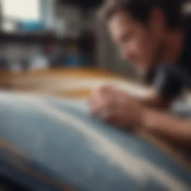 A Christenson fin being expertly attached to a surfboard by a skilled craftsman