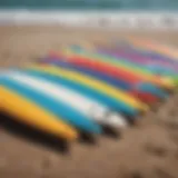 Colorful beginner surfboards lined up on the beach