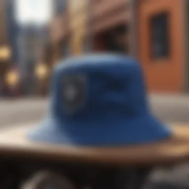 A blue bandana bucket hat resting on a skateboard