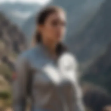 Athletic female in champion sweatsuit conquering a rugged mountain terrain