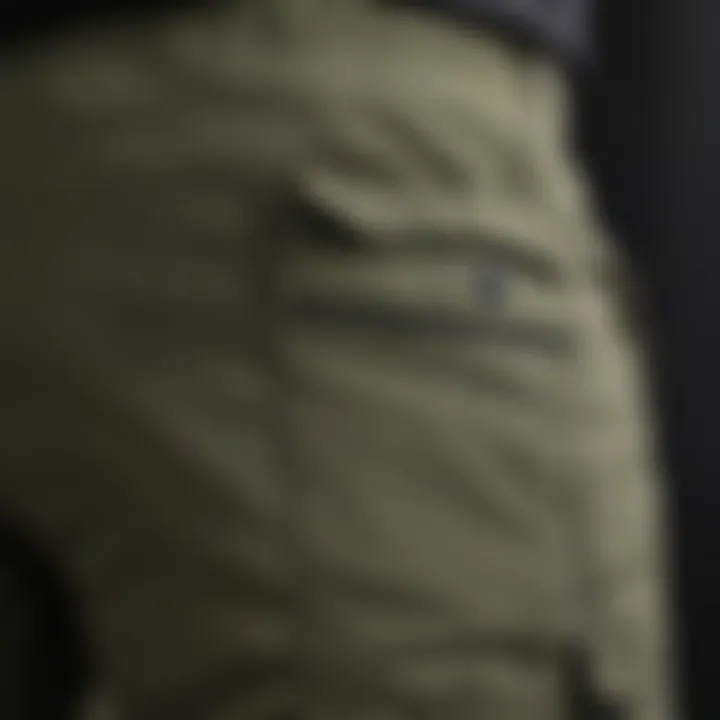 Close-up of pocket details on army green cargo joggers