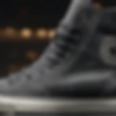 Close-up of dark grey Converse high tops' intricate stitching detail