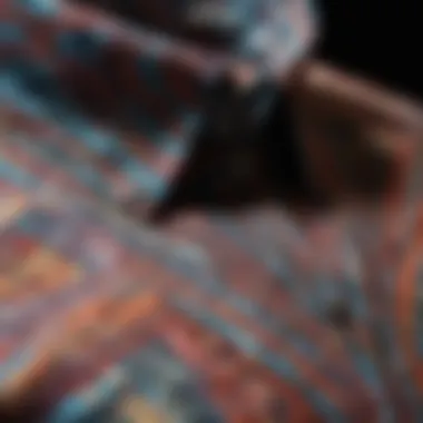 Close-up of an abstract button-up shirt with vibrant geometric patterns