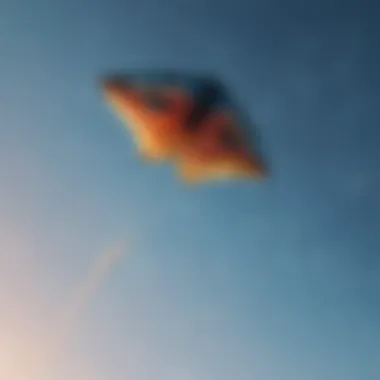 Close-up of a kite soaring high in the vibrant blue sky