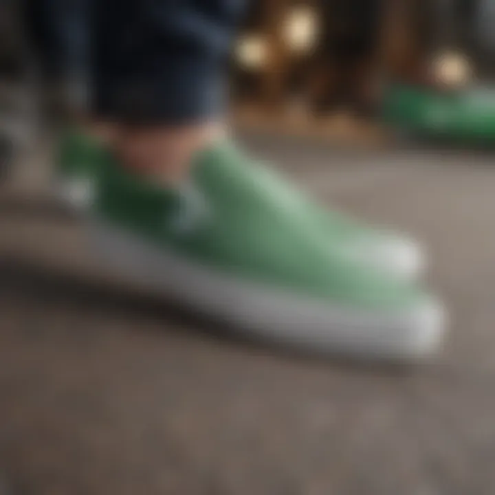 A stylish individual wearing green and white slip-on Vans at an extreme sports event.