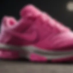 A close-up view of hot pink Nike shoes showcasing their design details.