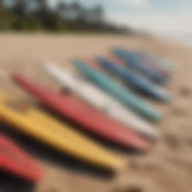 Close-up of surfboards lined up on the sand.