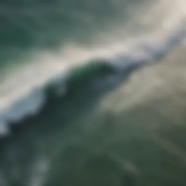 Aerial view of surfers navigating the waves at Pacific Beach Surfline