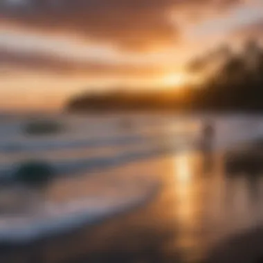 Vibrant sunset over the ocean with surfers in the water at Hilo Bay