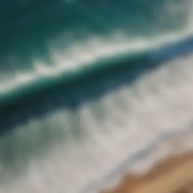 Waves at Mahai'ula Beach An aerial view of waves crashing on the shore at Mahai'ula Beach