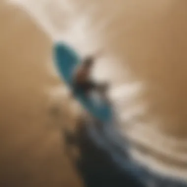 An aerial view of a skim boarder performing a trick