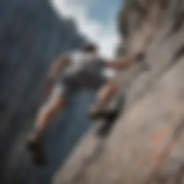 Rock climber scaling a challenging cliff in grey sweatshorts