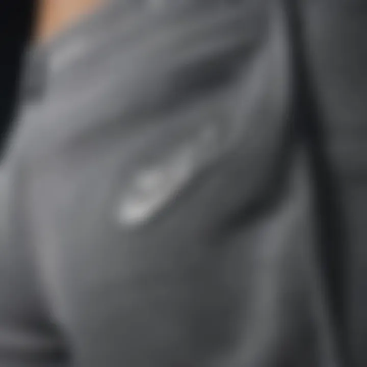 Close-up of intricate stitching details on Nike grey shorts