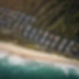 An aerial view of the Kelly Slater Surf Camp showcasing the pristine coastline and surf break.