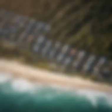 An aerial view of the Kelly Slater Surf Camp showcasing the pristine coastline and surf break.