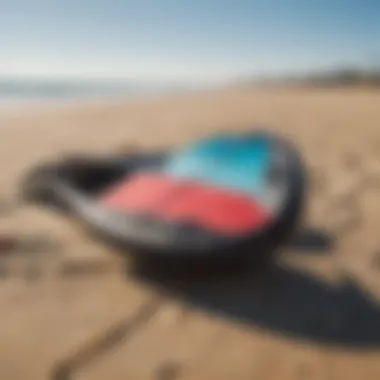 Close-up of kite surfing equipment laid out on the beach