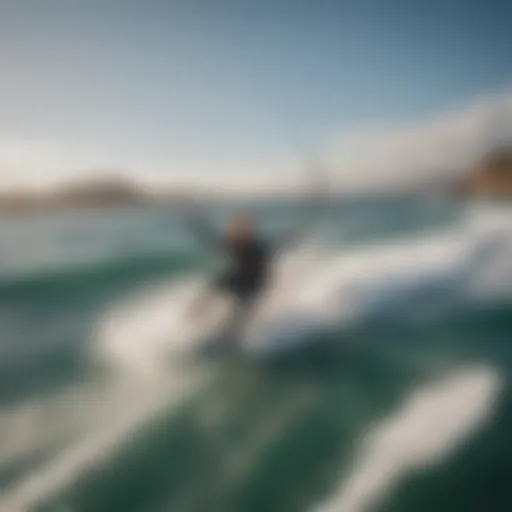 Aerial view of kiteboarder riding the waves