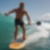 Laird Hamilton paddle board in motion on turquoise waves