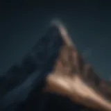 Moonlit Mountain Peak in Darkness