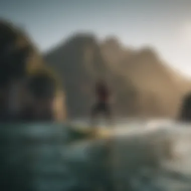 An action shot of a paddleboarder gliding over calm waters, demonstrating the performance of Naish paddleboards.