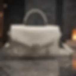 Elegant off-white shoulder bag on marble background