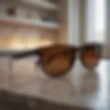 Sleek and stylish wayfarer sunglasses on a marble countertop