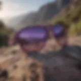 Purple camo sunglasses with rugged terrain background