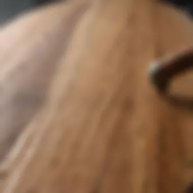 Artistic sanding technique on skateboard deck Skateboard deck being sanded to reveal natural wood grain