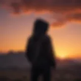 Silhouette of a lone figure wearing a big black hoodie against a fiery sunset backdrop