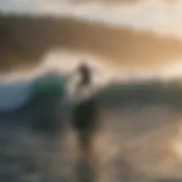 Surfer catching a wave at sunrise on Big Island