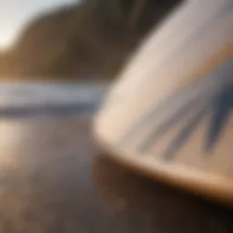 A close-up of a short surfboard showcasing its sleek design and fin setup.