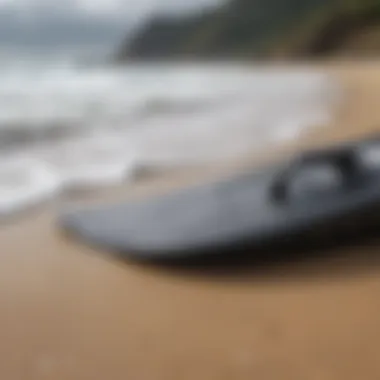 Close-up of a bodyboard and fins on the beach