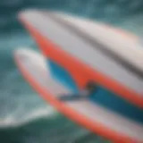 A close-up view of a kiteboard fin showcasing its sleek design and curvature.