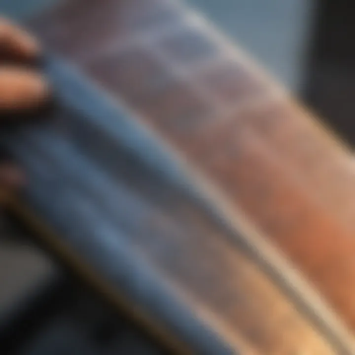 A kiteboard fin being inspected for maintenance, highlighting essential care tips.