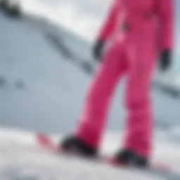 Vibrant pink snowboard pants showcased on a snow-covered slope
