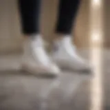 White leather sneakers on marble floor