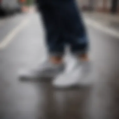 Elegant silhouette of Vans Old Skool Drizzle Grey & White Skate Shoes on city street