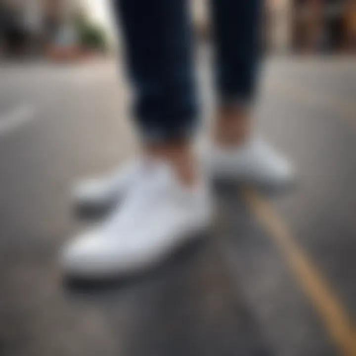 White low top Vans standing on urban pavement