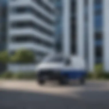 White van with blue stripe parked against a backdrop of modern architecture